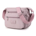 Bolsa Compacta em Nylon Resistente à Água e Fechamento em Zíper Bolsa Compacta em Nylon Resistente à Água e Fechamento em Zíper Importe Go Lilás 